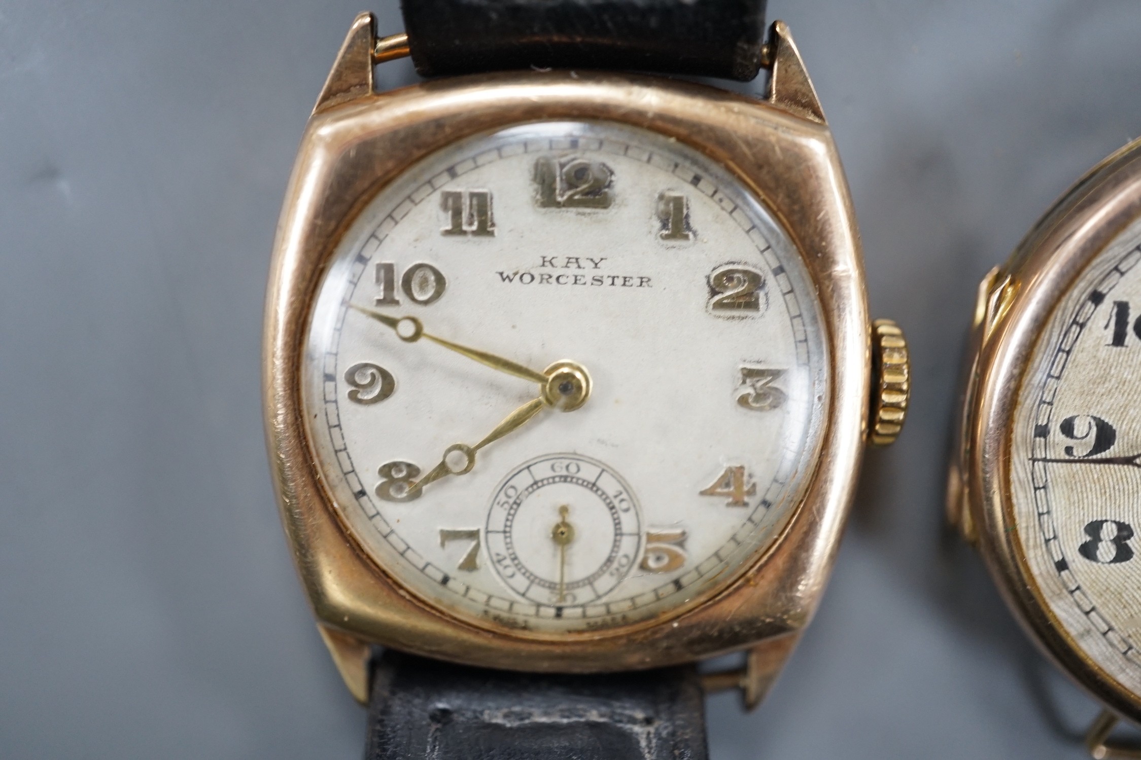 A gentleman's 1930's 9ct gold manual wind wrist watch (no strap), with case back inscription and one other gentleman's yellow metal manual wind wrist watch.